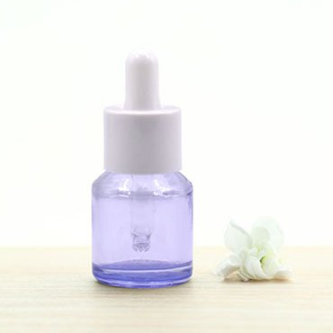 purple glass dropper bottle