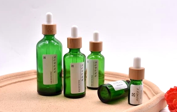 green essential oil dropper bottle